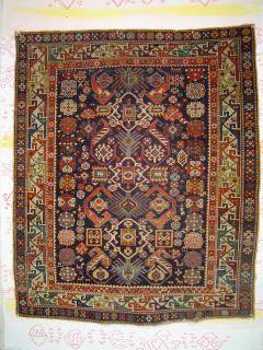  Shirvan prayer rug, midnight blue field, 122 x 148 cm. Late 19th century.Fine weave,saturated colors, inventive design variant.