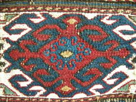 Shahsavan mafrash end panel, 60 x 42 cms, wool warps, wool and some cotton extra weft wrapping; stylised cloud collar motifs in centre band. (T0206)