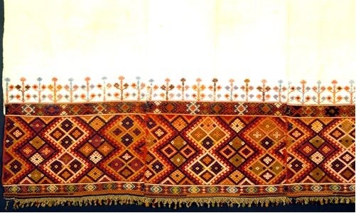 Woven bedcover from Crete, densely decorated with loom embroidered geometric designs in vivid colours. 19th c. (ΕΕ 3164) image and text Benaki Museum