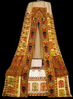 Multi-coloured embroidered sperveri (bed-tent) with spectacular foliate decoration, flower-vases and peacocks. From Rhodes island. Among the few surviving examples, this is the best and the best preserved. The workmanship combines sumptuous style with excellent execution, the strict compilation of an overall pattern with echoes of Byzantine splendour, and radiance of a joyous sensation with the sensory nature of the neo-Hellenic mode of expression. 17th-18th c. H. 4, circumference of lower border 10 m. Gift of Helen Stathatos. (ΓΕ 7650) image and text copyright Benaki Museum