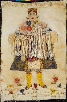 Embroidered depiction of a woman wearing the costume of Kastellorizo, a Dodecanese island. A primitive rendering of one of the most impressive of all Greek costumes. 0.45x0.30 m. (ΓΕ 23828) image and text copyright Benaki Museum