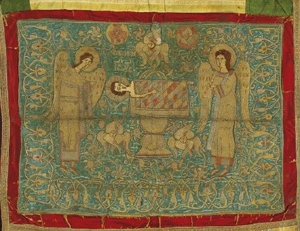 Aer, veil embroidered with gold thread, a liturgical article used to cover sacred vessels on an altar. The Melismos, a symbolic representation of the Holy Eucharist, is portrayed on it with the Child Jesus on a paten below an asteriskos, a star-shaped frame surmounted by a cross, and flanked by adoring angels, seraphim and flowers. Second half of the 16th c. 0.60x0.68 m. (ΓΕ 9340) image and text copyright Benaki Museum