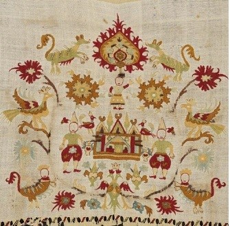 Embroidery on a bridal sheet from Skyros, an island in the Sporades. Abundant floral decoration surrounds the central architectural subject: the depiction of an enviable residence with birds, mythical beasts, human figures, and the apotropaic-talismanic symbol of a double-headed eagle. 18th c. Gift of Mari Zarifi. (ΓΕ 8484) image and text copyright Benaki Museum