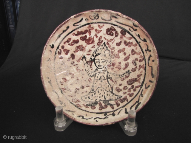 Nishapur Pottery Bowl

Small early Islamic Central Asian Persian bowl decorated with a figure of a woman in the center and Arabic calligraphy on the rim.. Circa 9/10th CE. Very good condition, aside  ...