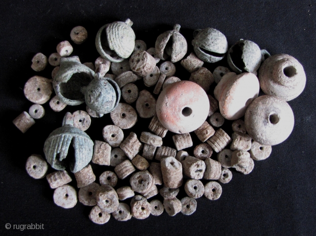 Dong Son Bells and Beads: Eclectic collection of small Dong Son Culture (1000BCE-100CE),bells, clay spindle whorls and beads made of fossilized Crinoid stems. There are 7 bells (3 in fair to good  ...