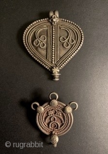 Two antique Indian charms from Tamil Nadu. The larger one is an Araimudi, in the shape of fig leaf and was by worn by young village girls to protect their “modesty”, the  ...