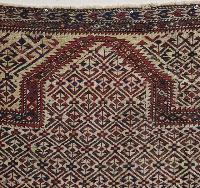 Unusual and rare Yomut Turkmen prayer rug. Circum-Caspian zone, most probably Ogurjali work (traditional for the tribe irregularities, colouring, set of borders, etc.), although with definite traces of 'foreign intrusions' for the  ...
