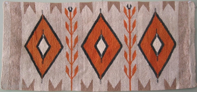 Navajo horse blanket, SW United States, 1st Qtr 20thC, corn stalks and three orange diamonds, outlined in black with a periwinkle tint, and a nice faded golden tan that once had a ...