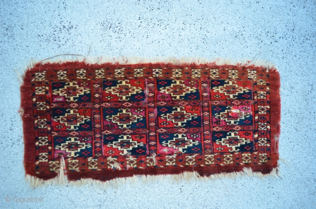 Turkmen. One jumbled up repair and wear and tear. Pink silk highlights in every other gol compartment.  Yellow silk highlights in some of the secondary motifs around the gols that are  ...