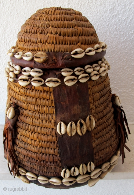 Rare Cappadocia Basket. Late 19th/early 20th c. Adorned with leather and cowrie shells. 31 x 21 cms.                