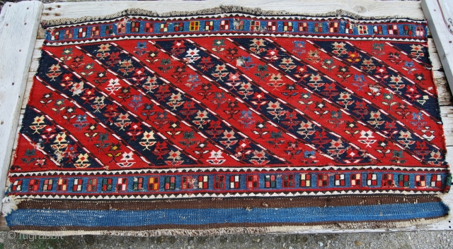 Mogan Shahsavan Sumakh Side Panel fragment. Cm 59x106. End 19th century. Beautiful moharamat pattern with diagonal stripes, 7 indigo blue, 7 madder red, with 126 flowers and 53 "windows"in the outer long ...