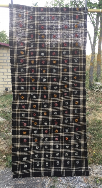 Goat hair kilim. Cm 113x243. Early to mid 20th century. Eastern Anatolia. Black & white checkered pattern with over hundred embroidered "guls". See description in here: http://rugrabbit.com/node/167998
      