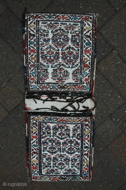 Shahsavan chanteh-khorjin, 19th C, 11-1/2 in. x 28-1/2 in. , natural dyes, bud and flower design, wool brocade on plain twill woven white ground; plain white back. Cloth strip inside and ...