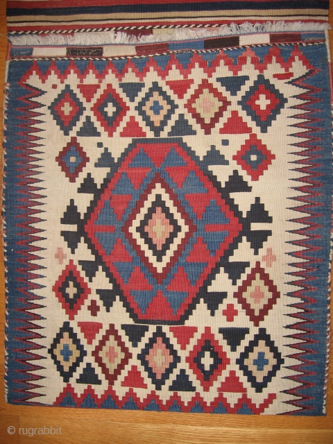 This nice pair of Kilim bags date about 1900. It has rewoven loop holes and new binding on the sides. The measurements are 59" x 20". These are very striking when ...