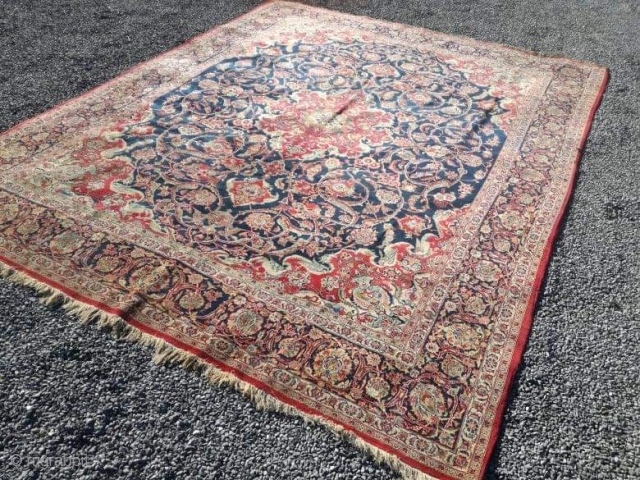 An old fine Kashan carpet with 340/260 cm. Generally in good shape with even high pile but a lot of spot moth demages.          