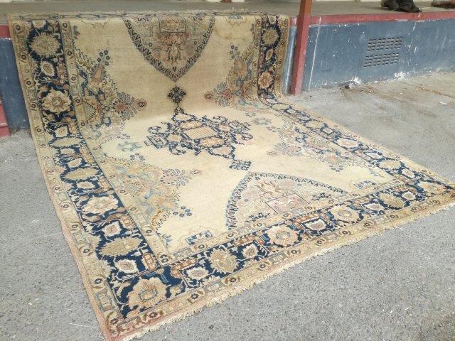 An antique Tabriz or NW Persian carpet with 397/296 cm. As found condition with moth demages and open side.              