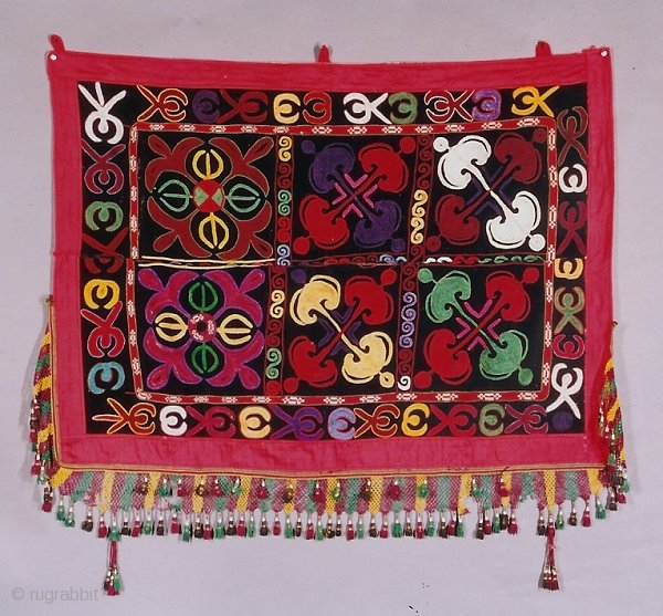 This is a turn of the century Central Asian wall hanging. Very good condition with fine embroidery and dyes.It is made from silk and velvet.