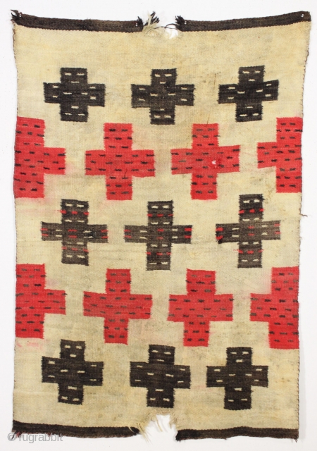 Antique Navajo weaving with intriguing design. So called "pound" rug or blanket. Crude, thick weave. Natural wool colors and characteristic red. Dirty and with end damage as shown. Late 19th c. 4'2" ...