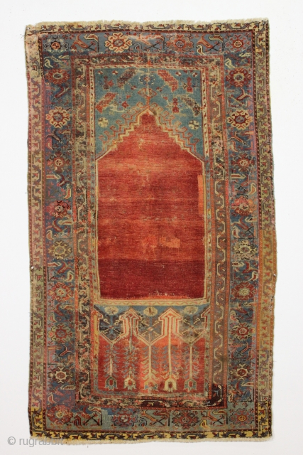 Antique Turkish Ladik prayer rug. Reweaves, faded patches, latex. You name it. A sampler of bad repair. Possibly 50% original. Most of the center is original and is at least early 19th ...