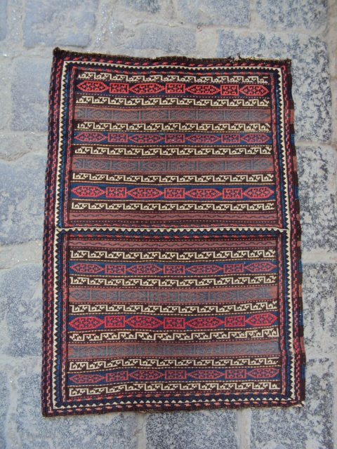 beluch of north eastern iran
open tobra 74\54 cm
weft-patterning with extra weft wrapping border
early 20th century