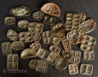 Buddhist Charms: Quirky and eclectic collection of 35 small repousse auspicious good luck tokens. These were collected in Dali, Yunnan, China in the late 1980s. No two are exactly alike and they  ...
