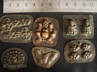 Buddhist Charms: Quirky and eclectic collection of 35 small repousse auspicious good luck tokens. These were collected in Dali, Yunnan, China in the late 1980s. No two are exactly alike and they  ...