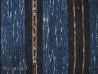 China: Exceptionally fine and rare three paneled ikat blanket from the Li people of Hainan Island, Southwest China. The lighter wide indigo bands consists of a coarse warp fiber most likely linen  ...