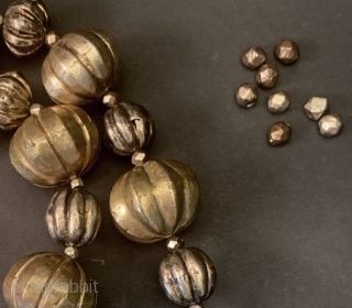 Old, circa 19th century gold washed silver beads from Sri Lanka. Total length: 53.8cm/21.2in. Beads range in diameter from largest:1.9cm/0.75in to smallest : 0.5cm/0.2in. Included are 8 extra beads (see enlargement). Total  ...