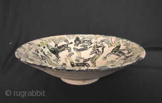 Nishapur Bowl: Large early Islamic Central Asian, Persian polychrome pottery bowl decorated with lively composition of animals - Circa 9/10th CE. Large repair (noted in last enlargements) and typical fritting. The red  ...