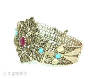 Impressive Persian/Indian Openwork Silver Bracelet, India or Iran, With Beautiful Cut Pink Garnet and Pair Of Turquoise on Both Sides of the Bracelet , Unique Openwork Cut Designs on Silver .
  