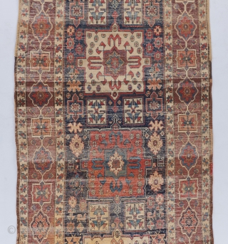 A beautiful Shahsavan runner with great age. 12'4". x 3''6". A dog stain towards the lower right and some heavier wear towards the bottom. Mostly in great pile.     