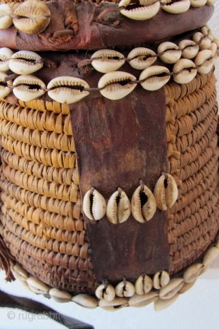 Rare Cappadocia Basket. Late 19th/early 20th c. Adorned with leather and cowrie shells. 31 x 21 cms.                