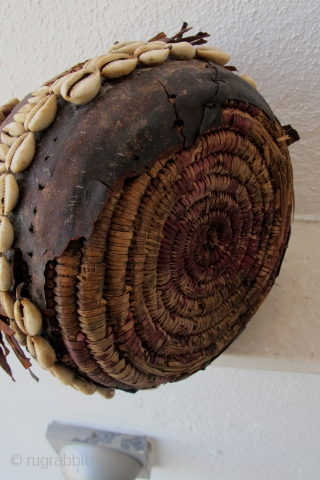 Rare Cappadocia Basket. Late 19th/early 20th c. Adorned with leather and cowrie shells. 31 x 21 cms.                
