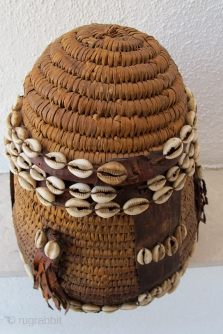 Rare Cappadocia Basket. Late 19th/early 20th c. Adorned with leather and cowrie shells. 31 x 21 cms.                
