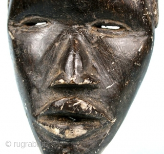Stone carved Dan/Ivory Coast-Liberia  mask. Second half 20t c. Cm 20x12x6,5. Weight 1kg/2pounds ca. Great carving quality.  Seems a "runners mask", while masks like this one are sacred and not  ...