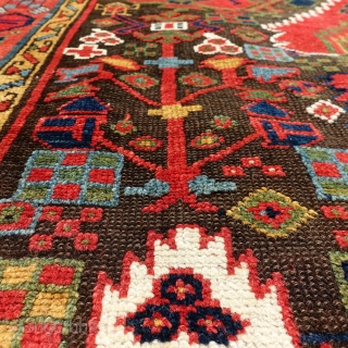 Antique Kurdish rug, Sauj Bulag, 126x238cm, around 1850 with the rare flame design. Fabulous, glowing colours on a brown, corroded field, some spots of cornflower blue silk.      