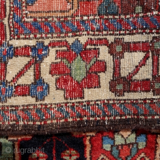 Bakhtiar from the village Âbâdji, circa 1900, 200x143cm, rare border, saturated colours, including beautiful pistachio green, good pile all over, damage in the middle field, 3 tears in the upper and bottom  ...