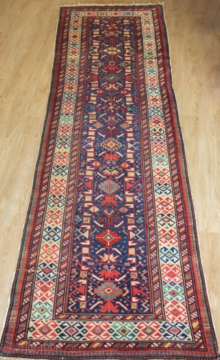 Kuba Runner, 19th century.  Wonderful floral designs and colors surrounded by a striking border.  In excellent condition.  114 x 365 cm         