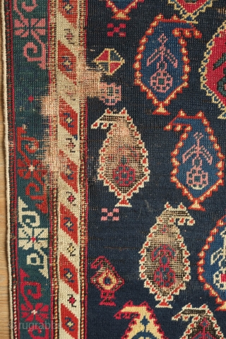 Shirvan Prayer Rug, 4th quarter of 19th Century.  Deep indigo blue ground and wonderful botehs in alternating directions.  The serrations around the botehs have the appearance of small "horns" on  ...