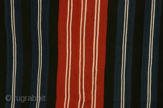 Bolovian woman's mantle ( iscayo), 40 x 44 inches 18th/early19th century. This is a strikingly graphic example of its type with atypically broad white lines boldly projecting from the blue and red  ...
