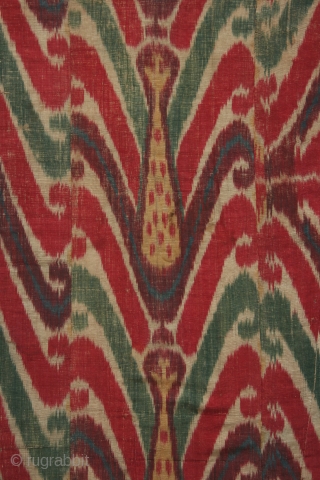 Uzbek ikat wallhanging, silk warp, cotton weft, 19th century, 46 x 58 inches, lining of hand spun hand woven cotton with a stamped or resist dyed design. The many fabric pieces comprising  ...