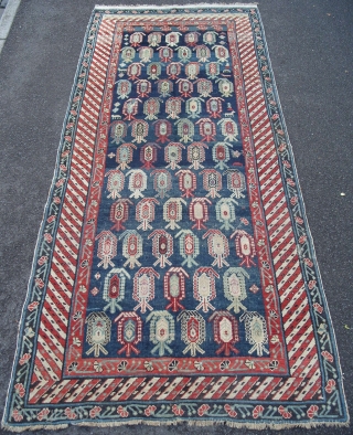 A Caucasian Kuba Long Rug with lots of botehs on a beautiful blue ground, ca 1900, very good condition, all original, 108x46 inches (273x116 cm). www.rugspecialist.com       