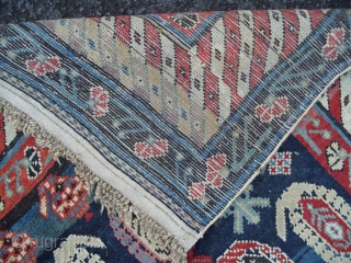 A Caucasian Kuba Long Rug with lots of botehs on a beautiful blue ground, ca 1900, very good condition, all original, 108x46 inches (273x116 cm). www.rugspecialist.com       