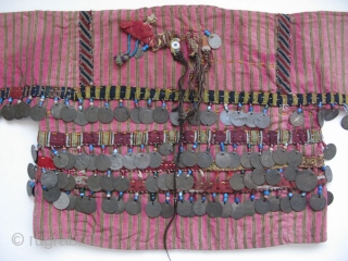 Anatolian Turkmen silk child's ceremonial jacket. Amulets and Talismanic pieces on the back. Ottoman coins from 19th. century. Size: 12" x 25"(30cm x 63cm)
