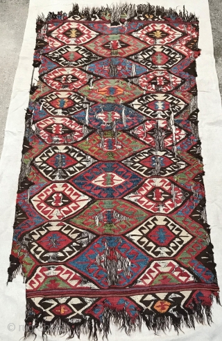 Mut kilim with good age and great colours, undyed brown wool warps, professionally mounted on linen, 275 x 145 cm including mounting.           