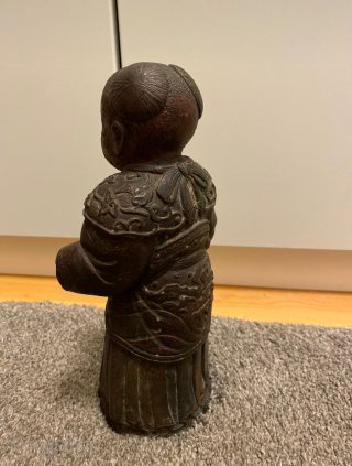 An ancient bronce statue from China with about 30 cm.                       