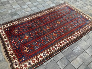 Old Kazak or Karabagh rug with 243/134 cm. Perfect condition with full pile.                    