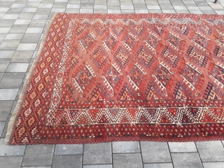 An old or antique Yomud Turkmen carpet with 354/200 cm. Good shape for its age with smallest repiles. Original endings on the long sides and kilim on one side.    