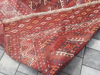 An old or antique Yomud Turkmen carpet with 354/200 cm. Good shape for its age with smallest repiles. Original endings on the long sides and kilim on one side.    