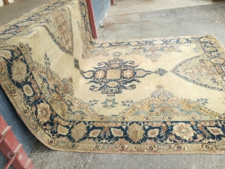An antique Tabriz or NW Persian carpet with 397/296 cm. As found condition with moth demages and open side.              